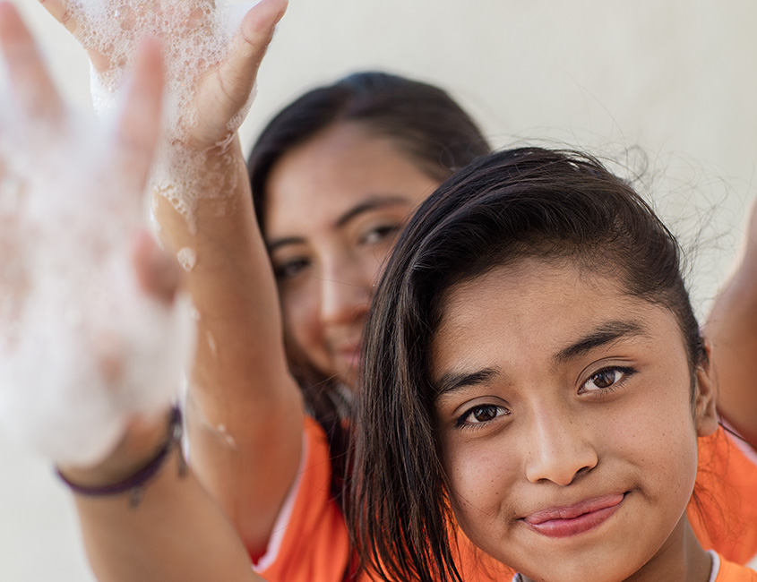 Two girls with soap on their hands (photo)