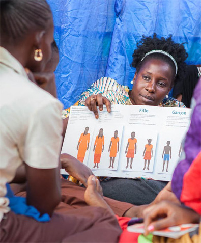 Adult teaches children (photo)