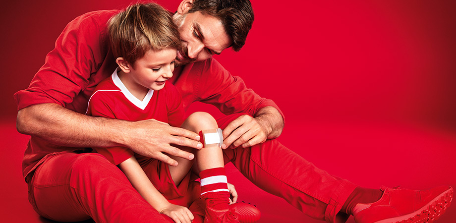 Man with boy in sporty clothes (photo)