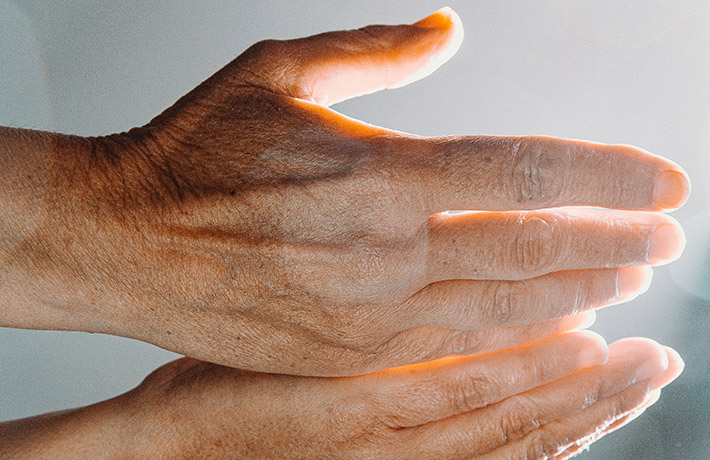 Hands with a shining light (photo)